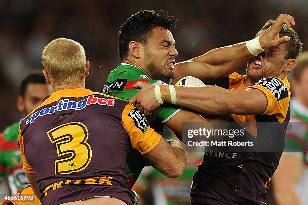 Ben Te'o of the Rabbitohs is tackled during the round 8 NRL match between the Brisbane Broncos and the South Sydney Rabbitohs at Suncorp Stadium on...