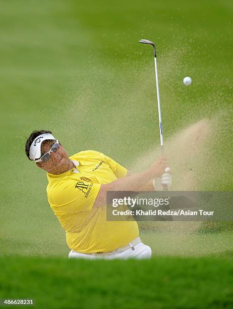 Kiradech Aphibarnrat of Thailand in action during round two of the CIMB Niaga Indonesian Masters at Royale Jakarta Golf Club on April 25, 2014 in...