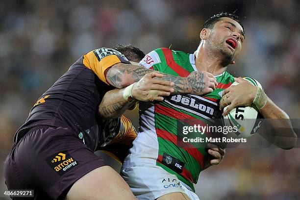 John Sutton of the Rabbitohs is tackled by Josh Mcguire of the Broncos during the round 8 NRL match between the Brisbane Broncos and the South Sydney...