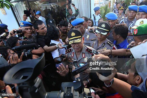Bali Police Chief Inspector Beni Mokalu answer journalist questions after Virgin Australia plane lands at International Ngurah Rai Airport on April...