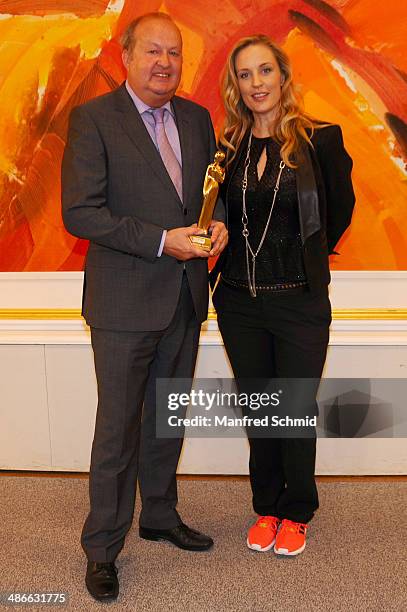 Alfred Grischgl and Lilian Klebow poses with the Romy statue at the Romy 2014 Academy Awards at Hofburg Vienna on April 24, 2014 in Vienna, Austria.