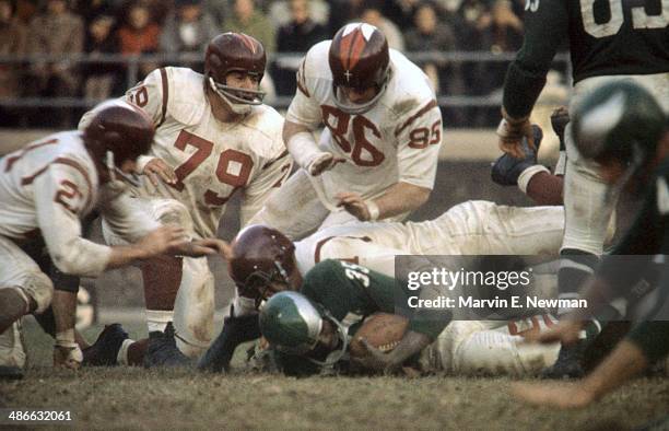 Philadelphia Eagles Ted Dean in action under pile on tackle vs Washington Redskins John Paluck , Bob Toneff , and Gary Glick at Franklin Field....