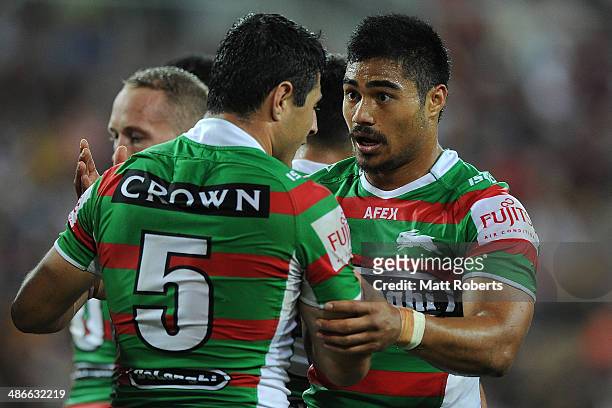 Kirisome Auva'a of the Rabbitohs speaks with team-mate Bryson Goodwin during the round 8 NRL match between the Brisbane Broncos and the South Sydney...