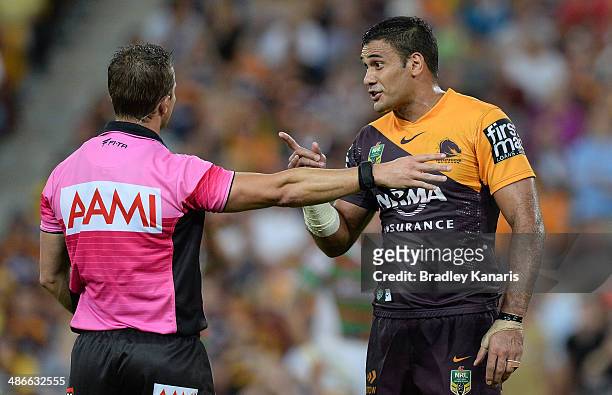 Justin Hodges of the Broncos questions referee Gavin Badger after a controversial decision during the round 8 NRL match between the Brisbane Broncos...