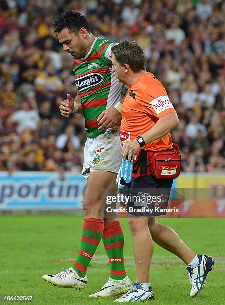 Ben Te'o of the Rabbitohs is taken from the field with an injured ankle during the round 8 NRL match between the Brisbane Broncos and the South...