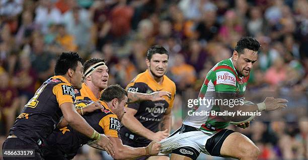 John Sutton of the Rabbitohs attempts to break away from the defence during the round 8 NRL match between the Brisbane Broncos and the South Sydney...