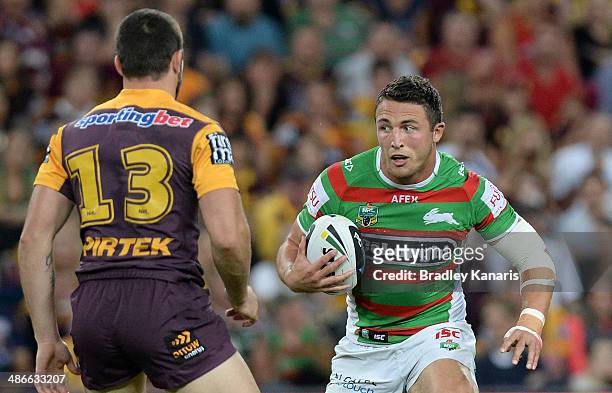 Sam Burgess of the Rabbitohs looks to take on the defence during the round 8 NRL match between the Brisbane Broncos and the South Sydney Rabbitohs at...