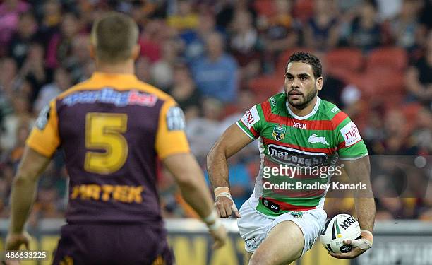 Greg Inglis of the Rabbitohs looks to take on the defence during the round 8 NRL match between the Brisbane Broncos and the South Sydney Rabbitohs at...