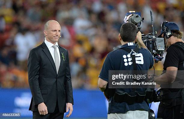 Former player Darren Lockyer is seen working for the commentary team before the round 8 NRL match between the Brisbane Broncos and the South Sydney...