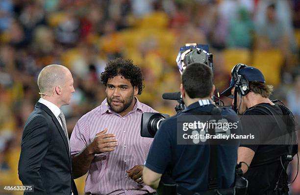 Former player Darren Lockyer is seen interviewing Sam Thaiday of the Broncos before the round 8 NRL match between the Brisbane Broncos and the South...