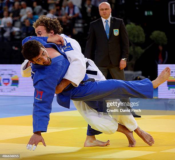 Ugo Legrand of France throws Nugari Tatalashvili of Georgia for a wazari to reach the semi-final during the Montpellier European Judo Championships...