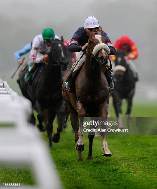 Jimmy Fortune riding Tullius win The bet365 Mile at Sandown racecourse on April 25, 2014 in Esher, England.