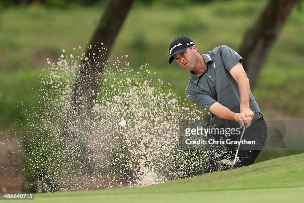 Ryan Palmer hits out of the bunker on the 2nd during Round Two of the Zurich Classic of New Orleans at TPC Louisiana on April 25, 2014 in Avondale,...