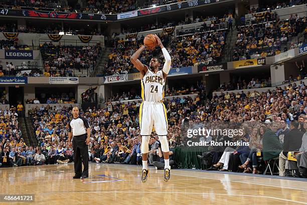 Paul George of the Indiana Pacers shoots against the Atlanta Hawks in game two of the East Conference Quarter Finals at Bankers Life Fieldhouse on...