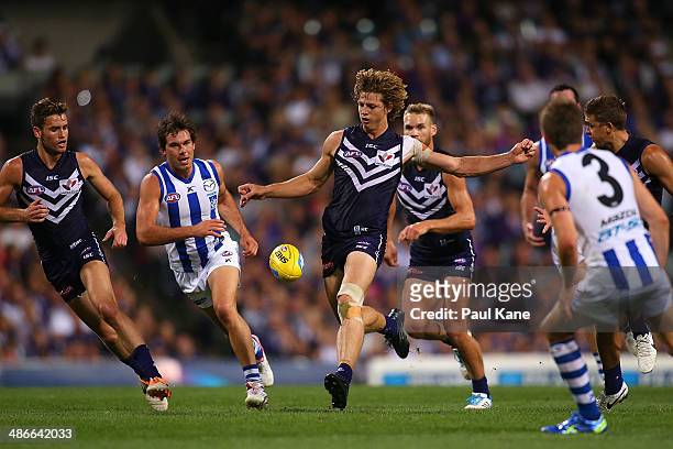 Nathan Fyfe of the Dockers kicks the ball forward during the round six AFL match between the Fremantle Dockers and the North Melbourne Kangaroos at...