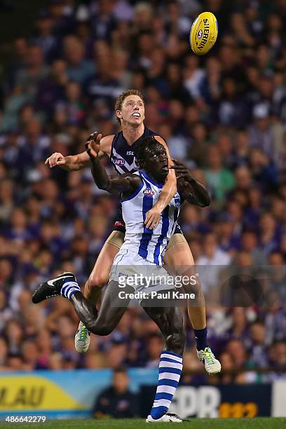 Zac Dawson of the Dockers spolis the mark for Majak Daw of the Kangaroos during the round six AFL match between the Fremantle Dockers and the North...