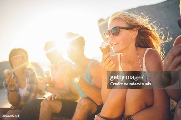 friends eating icecream on beach - sun flare on glass bildbanksfoton och bilder