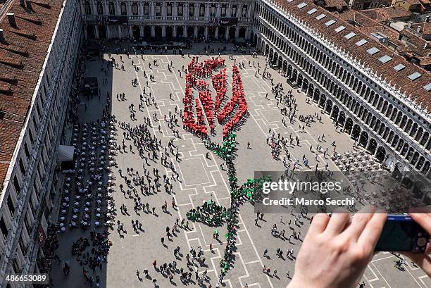 Human Rosing Artists Create A Human Red Rose In Venice Photos and Premium High Res ...