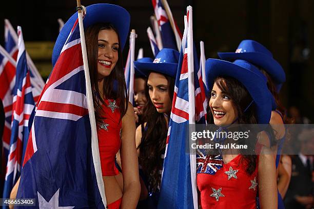 Flag bearers look on before entering the field for an Anzac Day tribute during the round six AFL match between the Fremantle Dockers and the North...