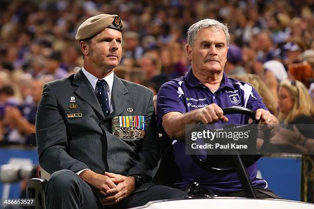 Serviceman is driven around the ground in a tribute to Anzac Day during the round six AFL match between the Fremantle Dockers and the North Melbourne...