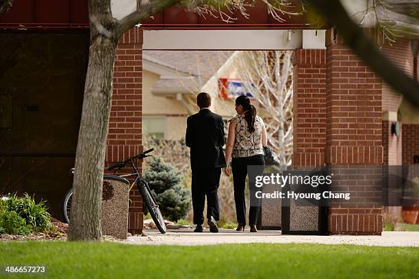 People walk into the Most Precious Blood Catholic Church. Kristine Kirk, allegedly killed by her husband while she called 911, is memorialized at...