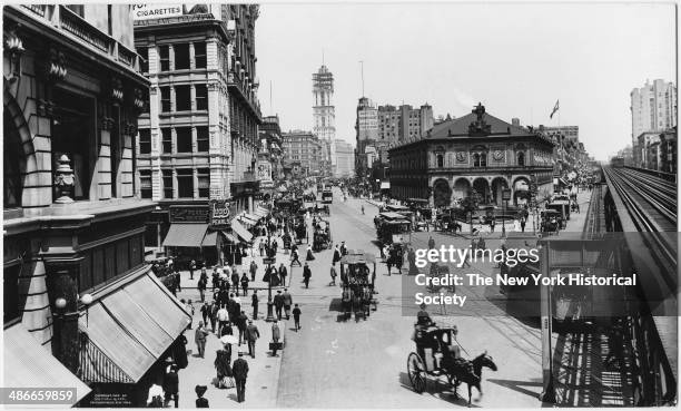 Herald Square, New York, New York, 1904. Herald Square Building and the Sixth Avenue elevated railroad tracks.