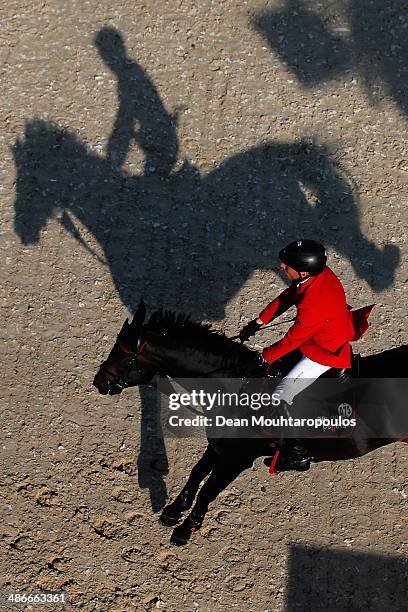 EHans-Dieter Dreher of Germany on Embassy II competes in the CSI5* Table A with one jump-off against the clock during day 2 of the Longines Global...