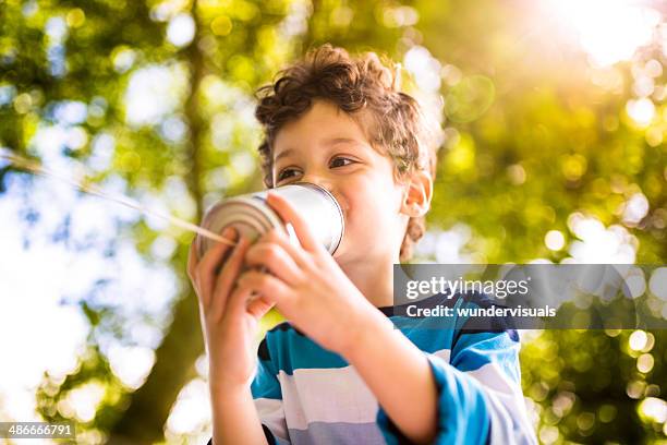 child communication concept - kids talking through cans stock pictures, royalty-free photos & images