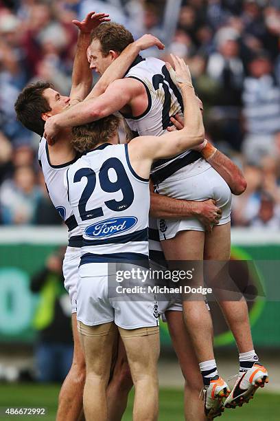 Steve Johnson (R0 of the Cats celebrates a goal with teammates during the round 23 AFL match between the Geelong Cats and the Adelaide Crows at...