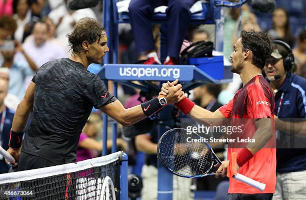 Rafael Nadal of Spain reacts shakes hands with Fabio Fognini of Italy after their match on Day Five of the 2015 US Open at the USTA Billie Jean King...
