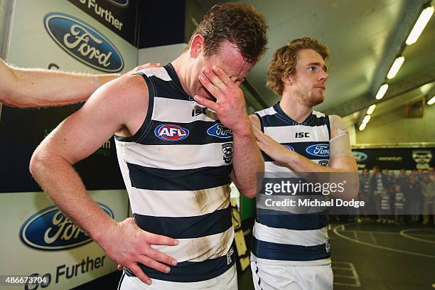 Steve Johnson of the Cats cries with Cameron Guthrie after playing his last game for the club during the round 23 AFL match between the Geelong Cats...