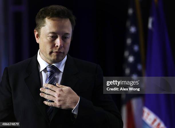 And chief designer of SpaceX Elon Musk arrives for a discussion during the 2014 annual conference of the Export-Import Bank April 25, 2014 in...