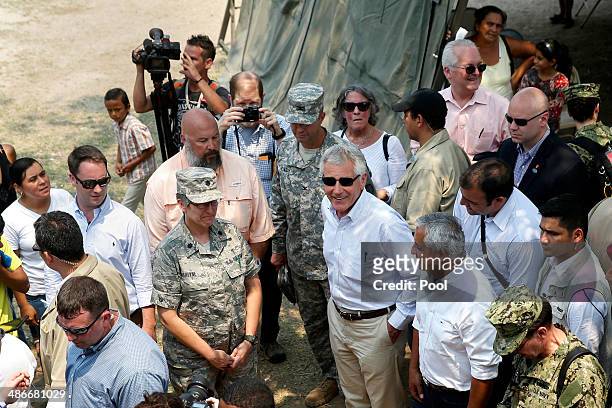 Defense Secretary Chuck Hagel and President of Guatemala Otto Perez Molina visit the Beyond the Horizons medical site on April 25, 2014 in Los...