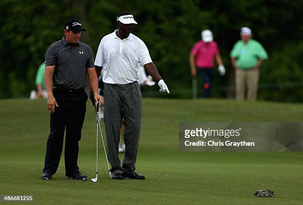 Vijay Singh has a run in with a baby alligator while trying to take his shot on the 7th during Round Two of the Zurich Classic of New Orleans at TPC...
