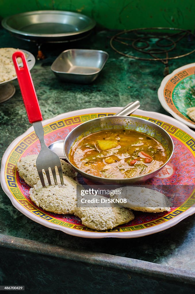 Vertical image of Indian snacks Idli- Sambhar