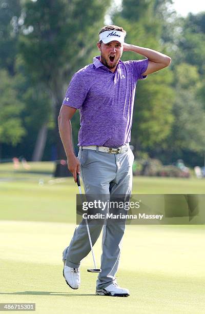 Jeff Overton yawns as he prepares to putt on the 9th at the end of his round during Round Two of the Zurich Classic of New Orleans at TPC Louisiana...