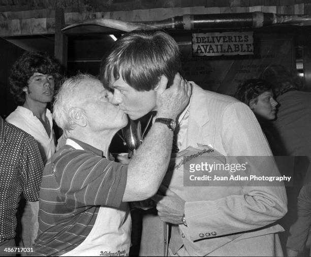Actor Mickey Rooney with his son Tim Rooney during festivities at the opening of his 'Mickey Rooney's Star-B-Q' restaurant, featuring menu items such...