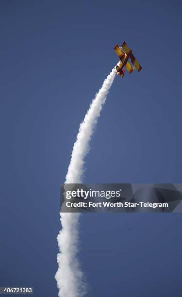 Aerobatic pilot Gene Soucy performs in his ShowCat airplane at a practice session for the Air Power Expo at Naval Air Station Fort Worth, Friday,...