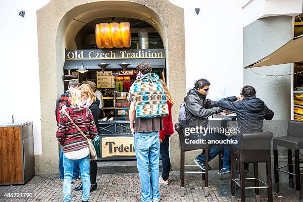 people buying  famous trdelnik, prague - trdelník stock pictures, royalty-free photos & images