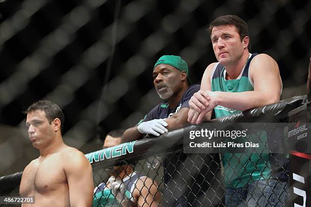 Team Sonnen fighter Job Kleber stands in his corner as Team Sonnen boxing coach Clayton Hires and coach Chael Sonnen stand above him before he faces...