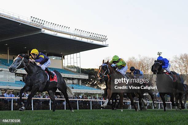 Dwayne Dunn riding Chautauqua defeats Vlad Duric riding Flamberge and Patrick Moloney riding Furnaces in Race 8, the Mitty's McEwan Stakes during...