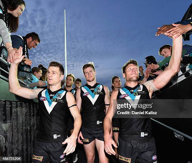 Robbie Gray of the Power and Brad Ebert of the Power react to the crowd after the round 23 AFL match between the Port Adelaide Power and the...