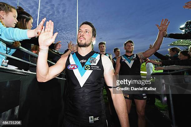 Travis Boak of the Power reacts as he leaves the field after the round 23 AFL match between the Port Adelaide Power and the Fremantle Dockers at...