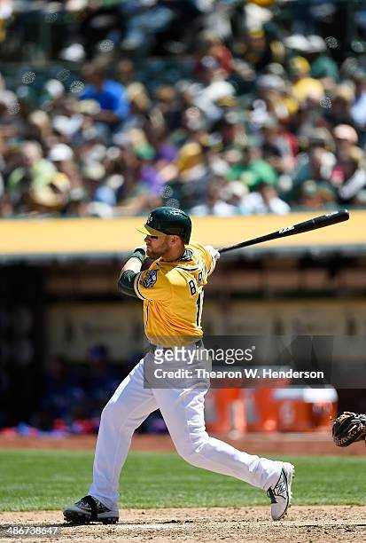Daric Barton of the Oakland Athletics bats against the Texas Rangers at O.co Coliseum on April 23, 2014 in Oakland, California.