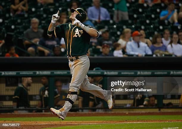 Josh Donaldson of the Oakland Athletics celebrates his two-run home run in the ninth inning of their game against the Houston Astros at Minute Maid...