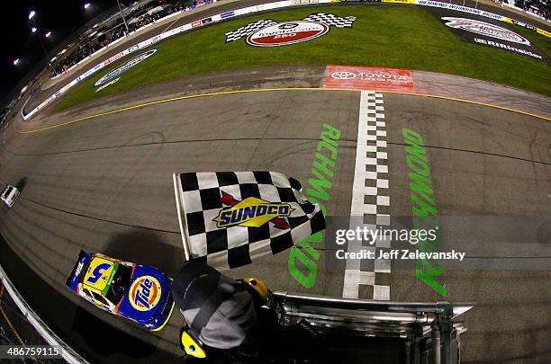 Kevin Harvick, driver of the Tide Chevrolet, races to the finishline to win the NASCAR Nationwide Series ToyotaCare 250 at Richmond International...