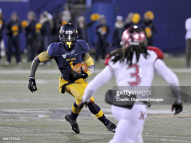 Wide receiver Dri Archer of the Kent State Golden Flashes carries the ball downfield during a game against the Miami Redhawks on November 13, 2013 at...