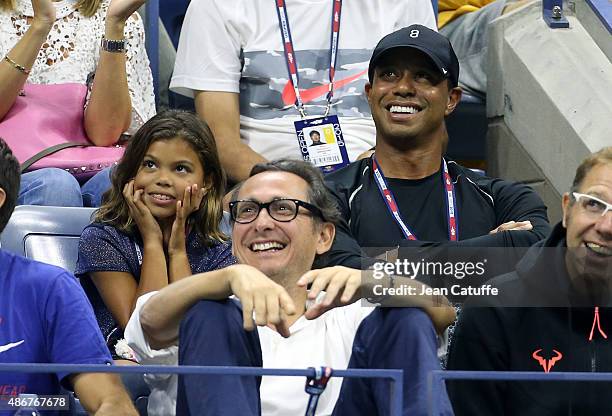 Tiger Woods and his daughter Sam Woods attend in Rafael Nadal's box his match against Fabio Fognini of Italy on day five of the 2015 US Open at USTA...