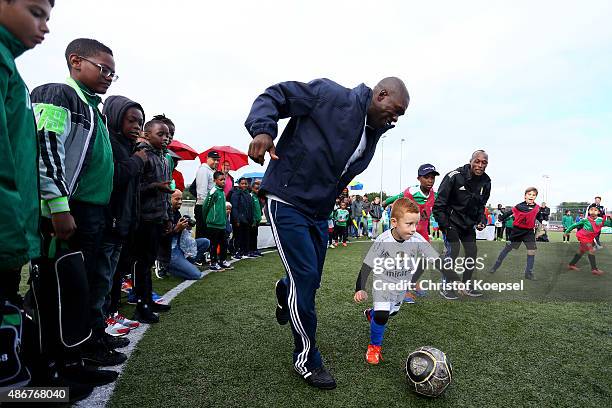 Clarence Seedorf, Laureus the Netherlands trustee plays with kids prior to the Laureus KickOffForGood Charity Match between Laureus All Stars against...