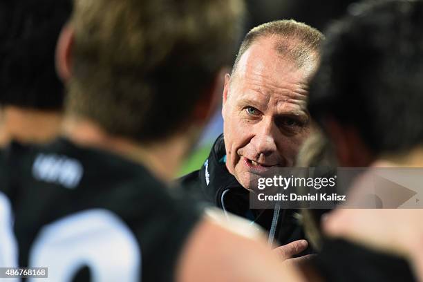 Ken Hinkley the coach of the Power addresses his players after the round 23 AFL match between the Port Adelaide Power and the Fremantle Dockers at...